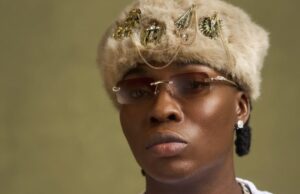 Reekado Banks tackles critic who called him a ‘failed artiste’ for going to church